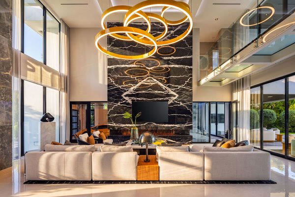Listing photo: great room with a marble wall